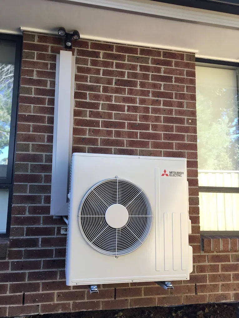 Mitsubishi Electric outdoor unit wall-mounted on brackets